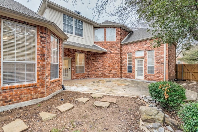 6637 Oakmont Ct, Plano, TX 75093 - back of property with a patio area, brick siding, and roof with shingles