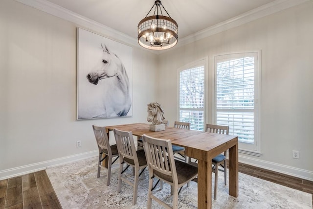6637 Oakmont Ct, Plano, TX 75093 - dining space with a chandelier, wood finished floors, baseboards, plenty of natural light, and ornamental molding