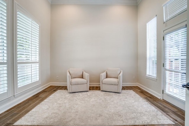 6637 Oakmont Ct, Plano, TX 75093 - sitting room with dark wood-style floors, crown molding, plenty of natural light, and baseboards