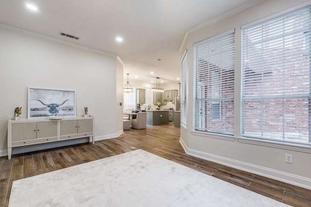 6637 Oakmont Ct, Plano, TX 75093 - living room featuring crown molding, wood finished floors, baseboards, recessed lighting, and a chandelier