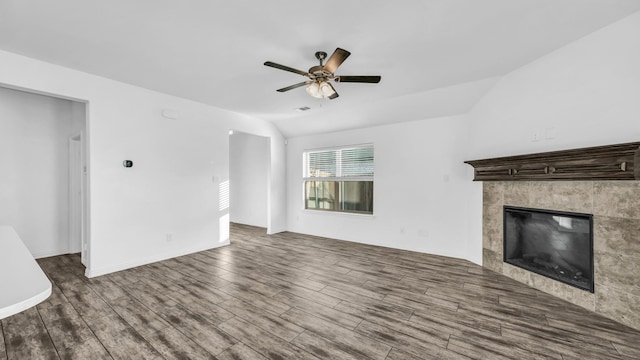 353 Paloma St, Weatherford, TX 76087 - unfurnished living room with a ceiling fan, wood finished floors, lofted ceiling, a fireplace, and baseboards