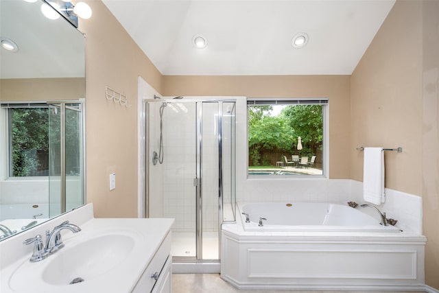 110 San Mateo Ct, Allen, TX 75013 - bathroom featuring vanity, a bath, a stall shower, lofted ceiling, and recessed lighting