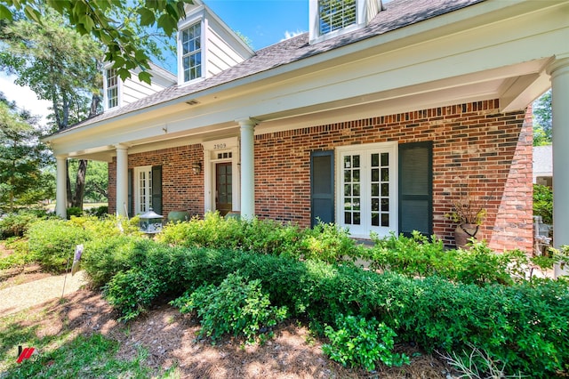 3909 Creswell Ave, Shreveport, LA 71106 - entrance to property with brick siding, french doors, and roof with shingles
