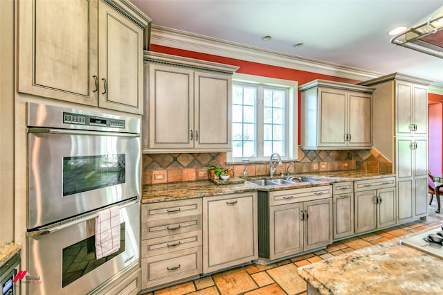 3909 Creswell Ave, Shreveport, LA 71106 - kitchen featuring double oven, a sink, decorative backsplash, light stone countertops, and ornamental molding