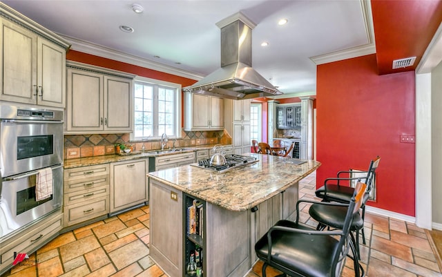 3909 Creswell Ave, Shreveport, LA 71106 - kitchen with stainless steel appliances, island range hood, a center island, a sink, and tasteful backsplash