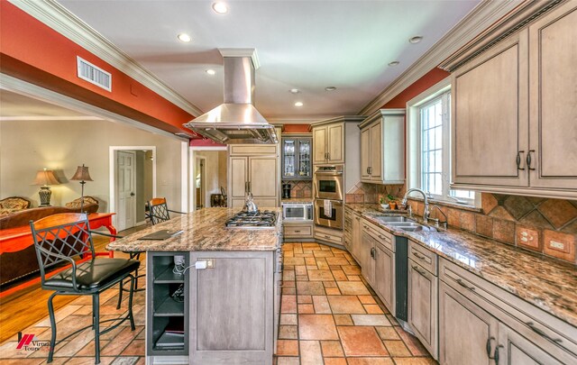 3909 Creswell Ave, Shreveport, LA 71106 - kitchen with a sink, island range hood, a kitchen breakfast bar, a center island, and ornamental molding
