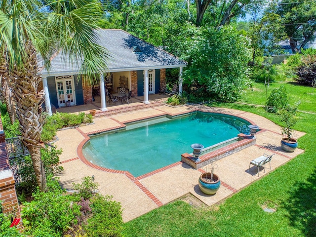 3909 Creswell Ave, Shreveport, LA 71106 - swimming pool featuring french doors, a patio area, and a lawn