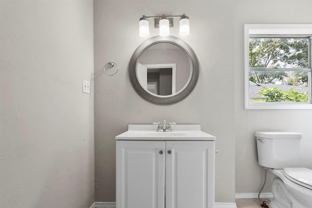 11022 Desdemona Dr, Dallas, TX 75228 - bathroom with vanity, toilet, and baseboards
