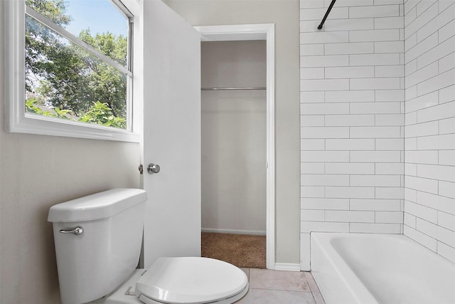 11022 Desdemona Dr, Dallas, TX 75228 - bathroom with toilet, healthy amount of natural light, washtub / shower combination, and tile patterned flooring