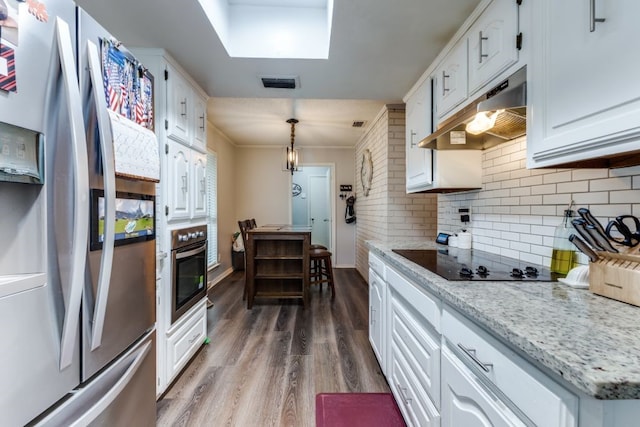 4937 Willowhaven Cir, Garland, TX 75043 - kitchen featuring stainless steel appliances, under cabinet range hood, dark wood finished floors, white cabinetry, and backsplash