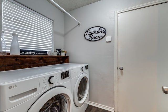 4937 Willowhaven Cir, Garland, TX 75043 - laundry area with washing machine and clothes dryer, wood finished floors, baseboards, and a textured ceiling