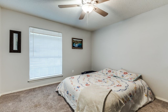 4937 Willowhaven Cir, Garland, TX 75043 - bedroom with carpet flooring, a ceiling fan, and baseboards
