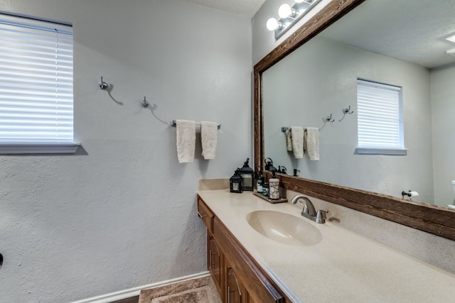 4937 Willowhaven Cir, Garland, TX 75043 - bathroom featuring vanity, toilet, and baseboards