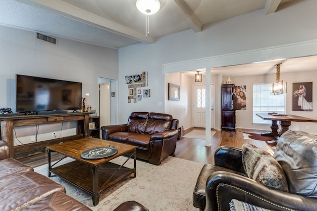 4937 Willowhaven Cir, Garland, TX 75043 - living area with wood finished floors, beamed ceiling, a chandelier, and baseboards