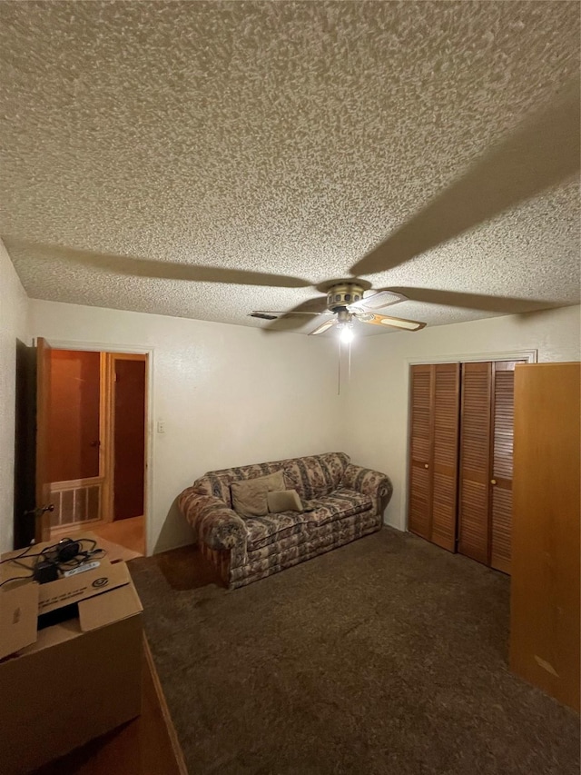 6320 Bocage Dr, Shreveport, LA 71119 - carpeted living room featuring ceiling fan and a textured ceiling