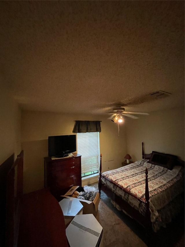 6320 Bocage Dr, Shreveport, LA 71119 - carpeted bedroom with a textured ceiling and ceiling fan
