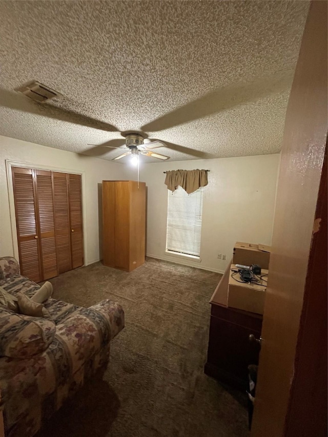 6320 Bocage Dr, Shreveport, LA 71119 - bedroom featuring a textured ceiling, carpet flooring, a closet, and a ceiling fan