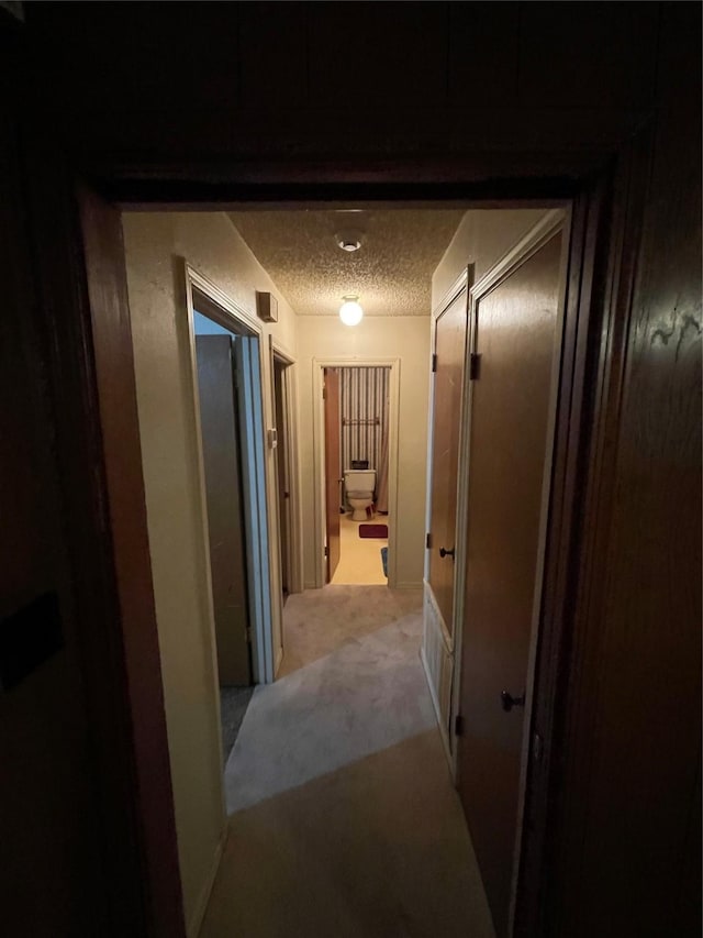 6320 Bocage Dr, Shreveport, LA 71119 - hall with a textured ceiling and light carpet