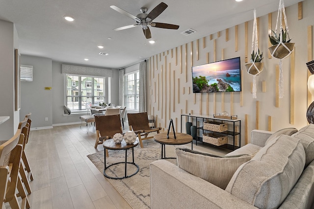 3701 Star Mesa Unit 14, Heartland, TX 75114 - living area featuring ceiling fan, recessed lighting, wood finished floors, baseboards, and an accent wall