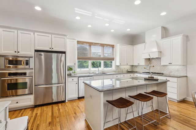 275 Casa Blanca Ave, Fort Worth, TX 76107 - kitchen with appliances with stainless steel finishes, a sink, white cabinetry, decorative backsplash, and recessed lighting