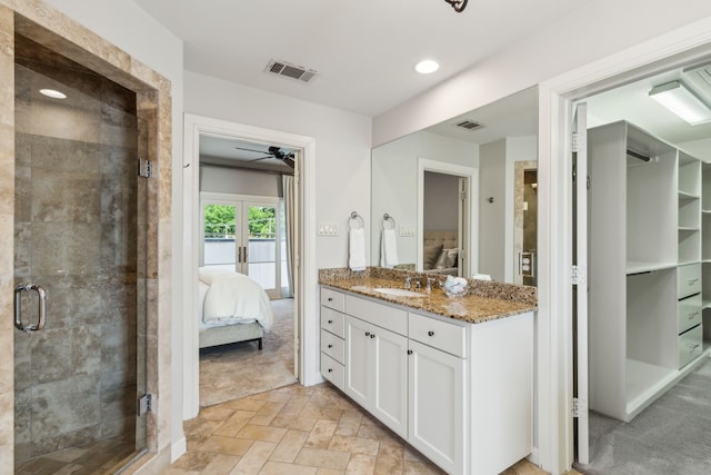 275 Casa Blanca Ave, Fort Worth, TX 76107 - bathroom with connected bathroom, vanity, ceiling fan, a stall shower, and stone finish floors