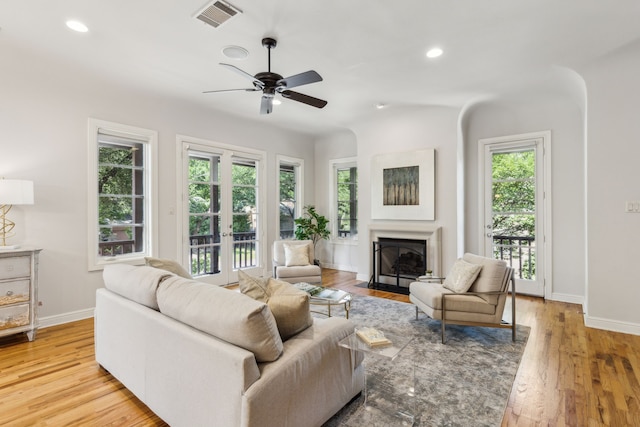 275 Casa Blanca Ave, Fort Worth, TX 76107 - living room featuring ceiling fan, a fireplace with flush hearth, recessed lighting, baseboards, and light wood-type flooring