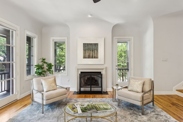 275 Casa Blanca Ave, Fort Worth, TX 76107 - living room with a fireplace with flush hearth, wood finished floors, stairs, and baseboards