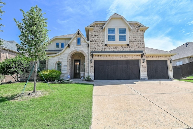 2230 Lewis Canyon Dr, Prosper, TX 75078 - french provincial home featuring stone siding, driveway, brick siding, and a garage
