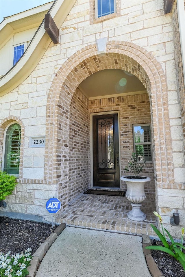2230 Lewis Canyon Dr, Prosper, TX 75078 - doorway to property featuring brick siding and stone siding