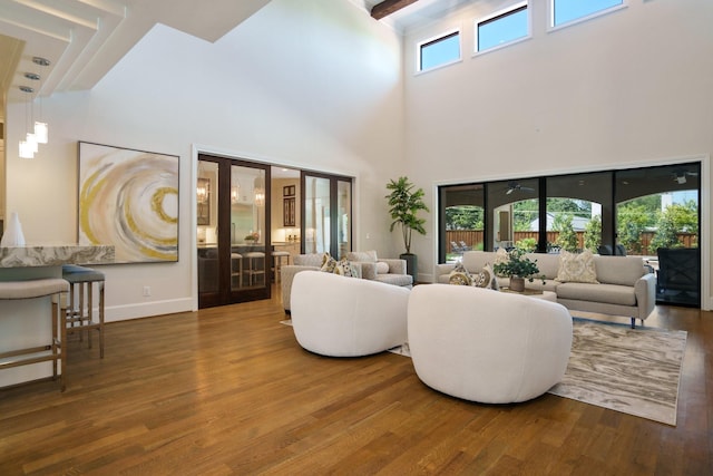 6807 Orchid Ln, Dallas, TX 75230 - living area with a towering ceiling, wood finished floors, and baseboards