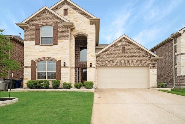 911 Bluewood St, Princeton, TX 75407 - french country style house with stone siding, an attached garage, and driveway