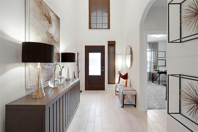 911 Bluewood St, Princeton, TX 75407 - foyer entrance featuring arched walkways, a towering ceiling, and baseboards