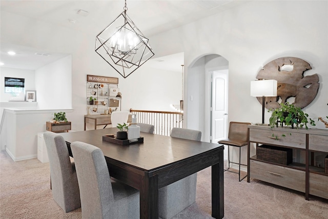 911 Bluewood St, Princeton, TX 75407 - dining area with light carpet, arched walkways, and a chandelier