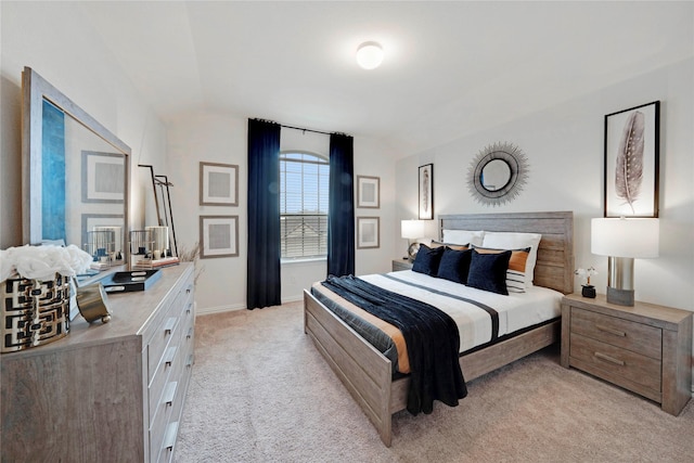 911 Bluewood St, Princeton, TX 75407 - bedroom featuring light colored carpet, vaulted ceiling, and baseboards