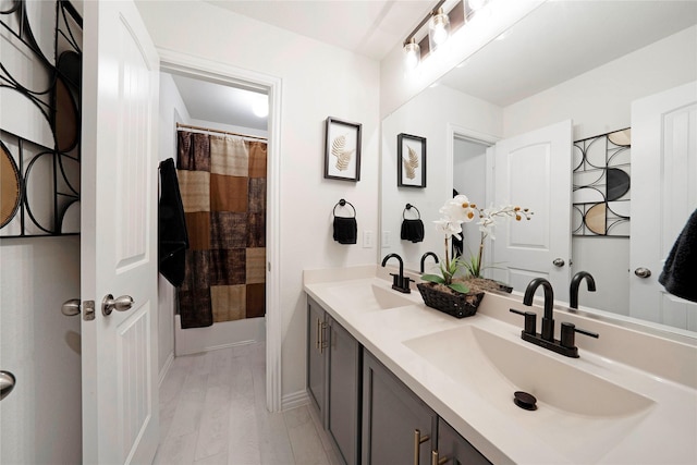 911 Bluewood St, Princeton, TX 75407 - bathroom featuring double vanity and baseboards