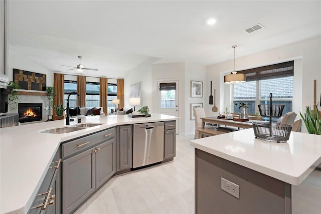 911 Bluewood St, Princeton, TX 75407 - kitchen featuring stainless steel dishwasher, a sink, gray cabinetry, light countertops, and recessed lighting