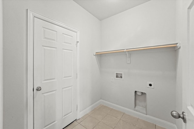 5653 Salt Springs Dr, Fort Worth, TX 76179 - washroom featuring electric dryer hookup, hookup for a washing machine, baseboards, and light tile patterned floors