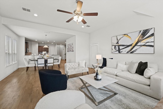 5653 Salt Springs Dr, Fort Worth, TX 76179 - living room featuring a ceiling fan, light wood finished floors, recessed lighting, and baseboards