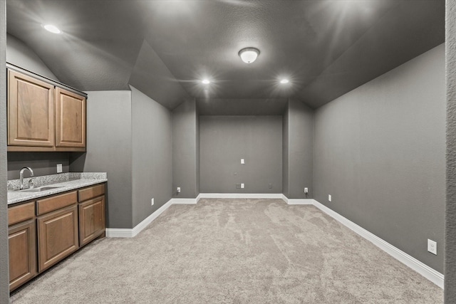 5653 Salt Springs Dr, Fort Worth, TX 76179 - below grade area with a sink, light colored carpet, baseboards, and recessed lighting