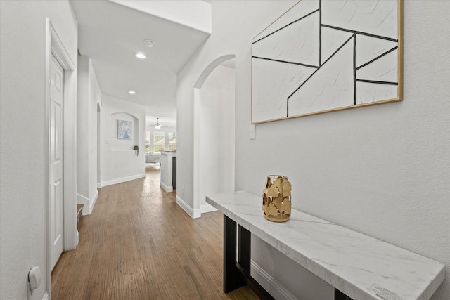 5653 Salt Springs Dr, Fort Worth, TX 76179 - corridor with arched walkways, wood finished floors, baseboards, and recessed lighting