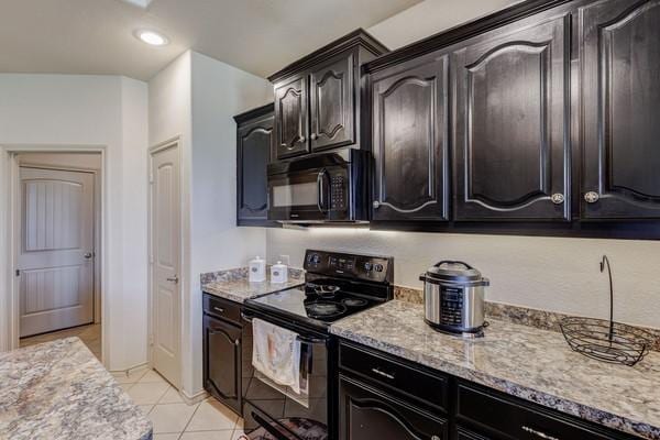 1300 Woodbine Cliff Dr, Fort Worth, TX 76179 - kitchen featuring black appliances, light tile patterned floors, light stone countertops, and recessed lighting
