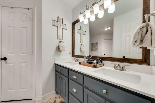 407 W Park Ave, Weatherford, TX 76086 - full bath with double vanity, baseboards, and tile patterned flooring