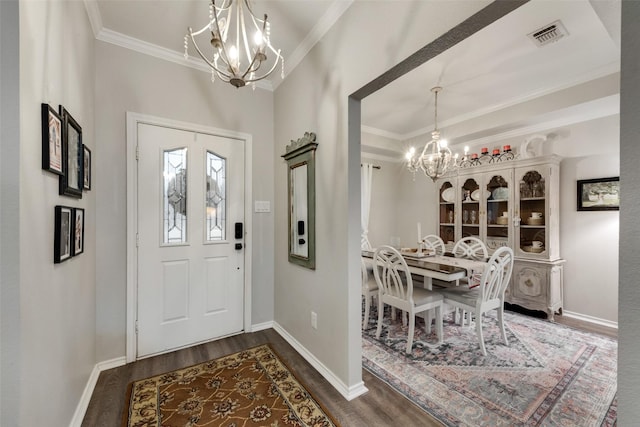 407 W Park Ave, Weatherford, TX 76086 - foyer entrance with a chandelier, wood finished floors, ornamental molding, and baseboards