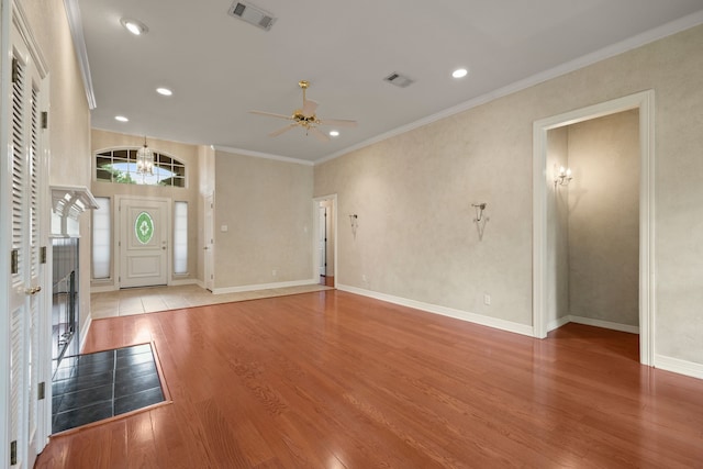 6808 N Oaks Dr, North Richland Hills, TX 76182 - foyer with wood finished floors, a ceiling fan, recessed lighting, crown molding, and baseboards