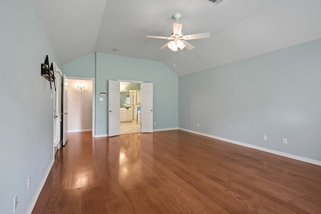 6808 N Oaks Dr, North Richland Hills, TX 76182 - unfurnished bedroom featuring vaulted ceiling, wood finished floors, and baseboards