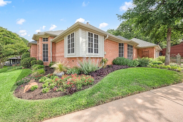 6808 N Oaks Dr, North Richland Hills, TX 76182 - view of side of property featuring brick siding