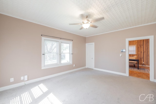 1126 Grand Ave, Abilene, TX 79605 - unfurnished bedroom with light carpet, ornamental molding, baseboards, and ceiling fan