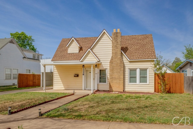 1126 Grand Ave, Abilene, TX 79605 - view of front facade with a shingled roof, a chimney, and a carport
