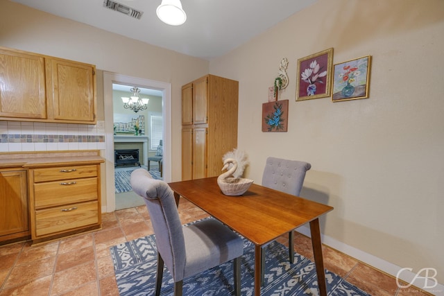 1126 Grand Ave, Abilene, TX 79605 - dining area with a chandelier and baseboards
