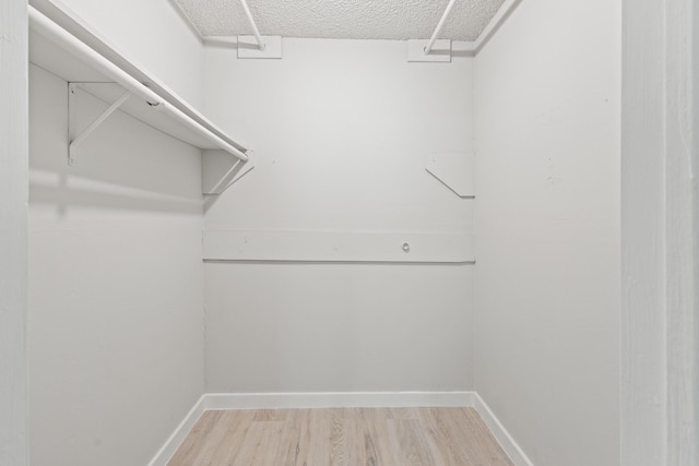 6206 Springwood Dr, Arlington, TX 76001 - spacious closet with light wood finished floors